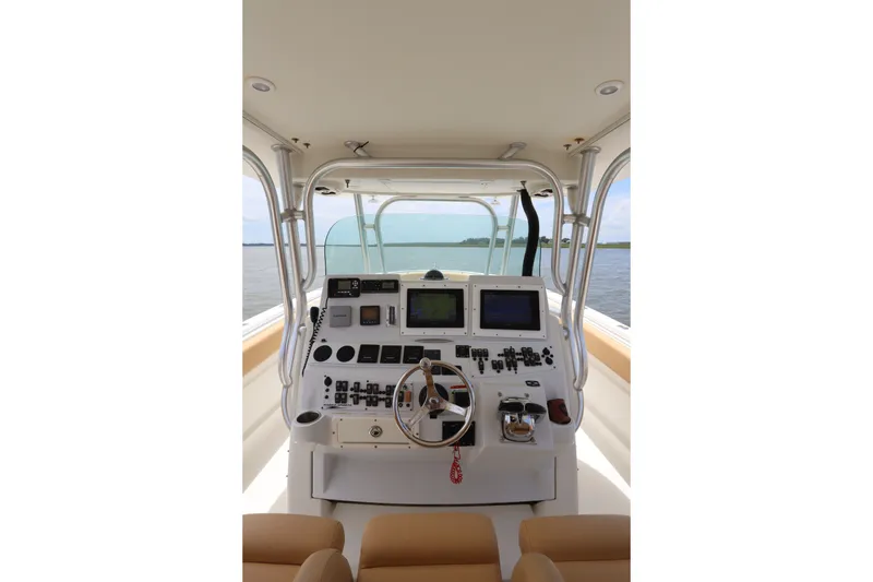 Slide: The Image of 2009 Hydra-Sports 4100 VSF boat cockpit with advanced navigation controls and dual screens. - 35