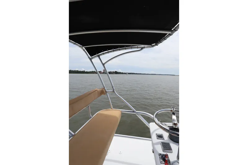 Slide: The Image of 2009 Hydra-Sports 4100 VSF boat view with canopy and water backdrop. - 25