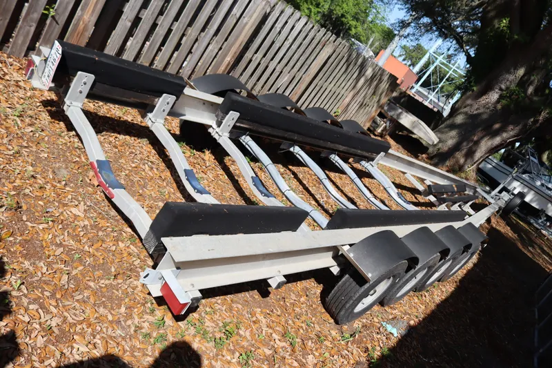 Slide: The Image of 2009 Hydra-Sports 4100 VSF boat trailer parked on leaf-covered ground. - 62