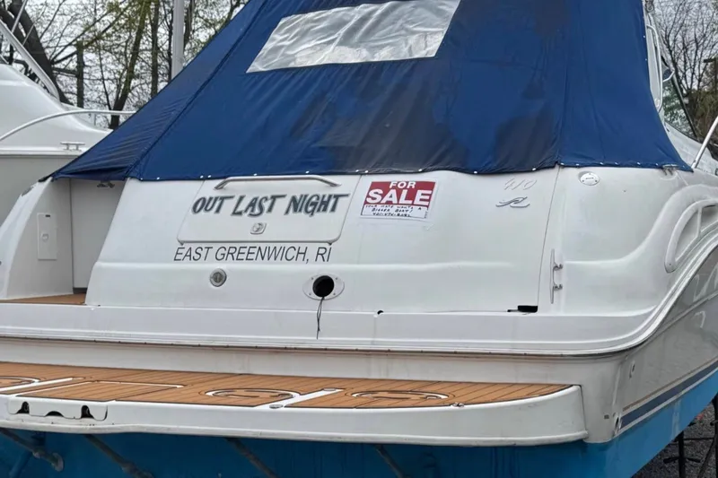 Slide: The Image of 2000 Sea Ray 410 Sundancer boat for sale, East Greenwich, RI, with blue cover. - 9