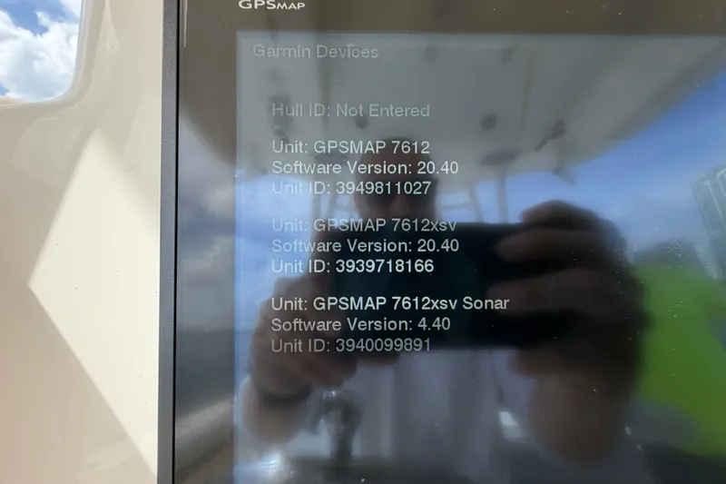 Slide: The Image of Garmin GPSMAP display on 2018 Cobia 301 Center Console boat, showing software versions. - 28