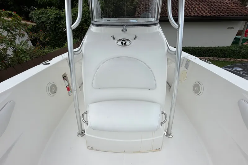 Slide: The Image of 2006 Boston Whaler 270 Outrage boat interior with white seating and stainless steel railings. - 42
