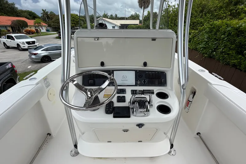 Slide: The Image of Boston Whaler 270 Outrage 2006 helm with steering wheel and control panel. - 16