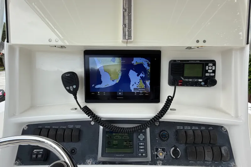 Slide: The Image of Dashboard of a 2006 Boston Whaler 270 Outrage with navigation and communication equipment. - 21