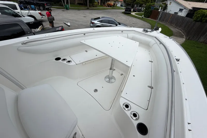 Slide: The Image of 2006 Boston Whaler 270 Outrage boat interior with seating and table setup. - 35