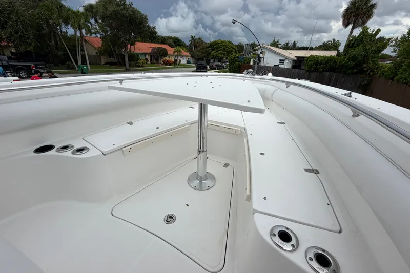 Slide: The Image of 2006 Boston Whaler 270 Outrage boat deck with table, surrounded by residential neighborhood. - 36