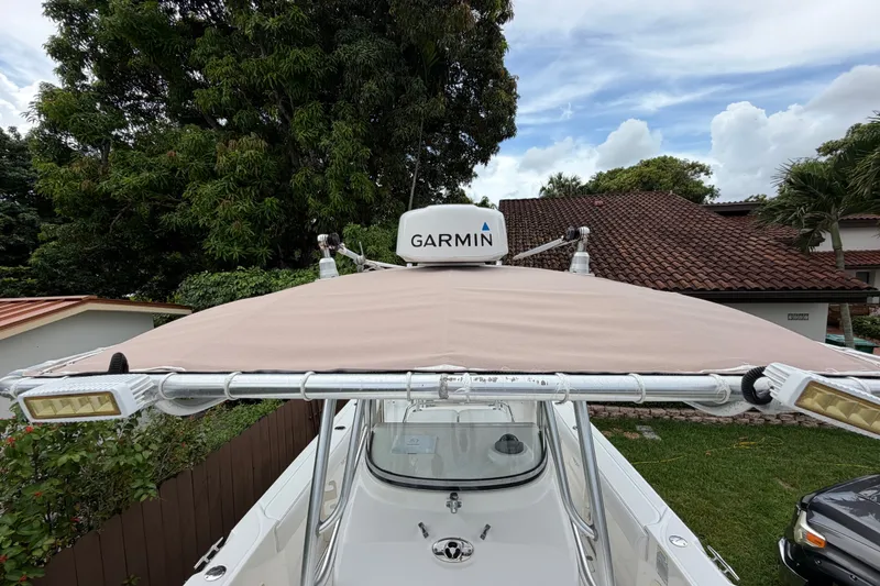 Slide: The Image of 2006 Boston Whaler 270 Outrage with Garmin radar, parked in a residential yard. - 41