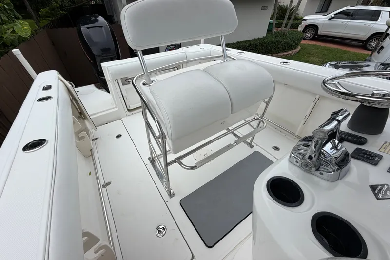 Slide: The Image of 2006 Boston Whaler 270 Outrage boat interior with helm seat and control panel. - 25