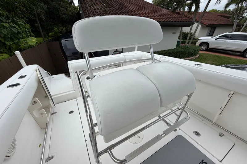 Slide: The Image of 2006 Boston Whaler 270 Outrage boat interior with white seating and stainless steel frame. - 26