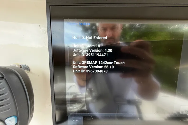 Slide: The Image of Display screen on a 2006 Boston Whaler 270 Outrage showing software versions and unit IDs. - 23