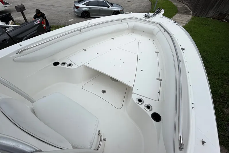 Slide: The Image of 2006 Boston Whaler 270 Outrage boat interior with seating and storage compartments. - 33
