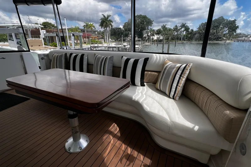Slide: The Image of Luxurious seating area on 2006 Sea Ray 40 Motor Yacht with scenic waterfront view. - 14