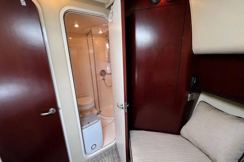 Slide: The Image of Interior of 2006 Sea Ray 40 Motor Yacht with bathroom and seating area. - 38