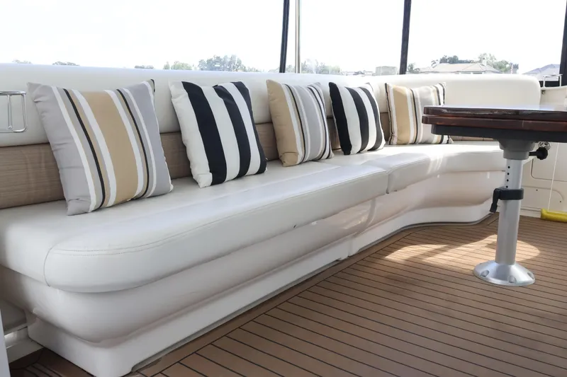 Slide: The Image of Luxurious seating area on 2006 Sea Ray 40 Motor Yacht with striped cushions. - 10