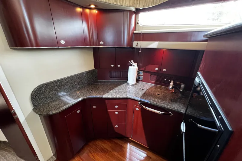 Slide: The Image of Luxurious kitchen interior of 2006 Sea Ray 40 Motor Yacht with cherry wood cabinets. - 36