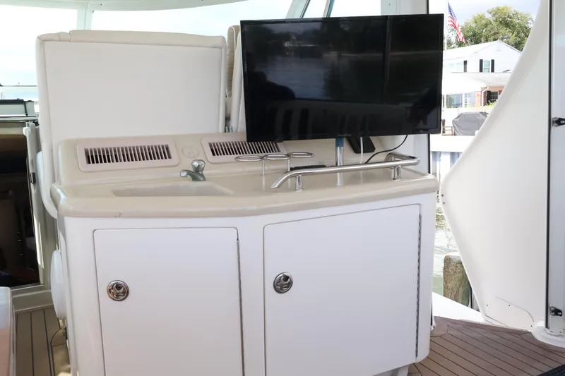 Slide: The Image of 2006 Sea Ray 40 Motor Yacht interior with sink and mounted TV. - 16