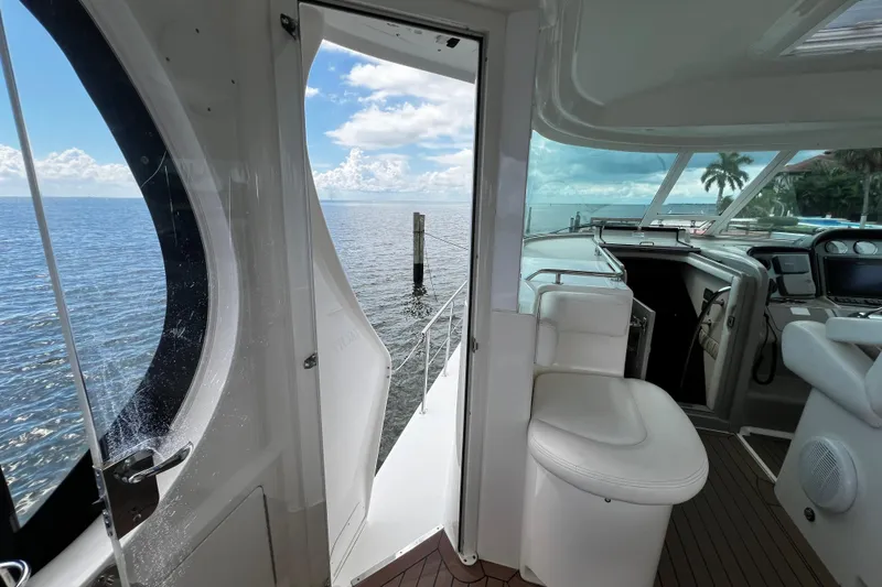 Slide: The Image of 2006 Sea Ray 40 Motor Yacht interior with ocean view through open door. - 19