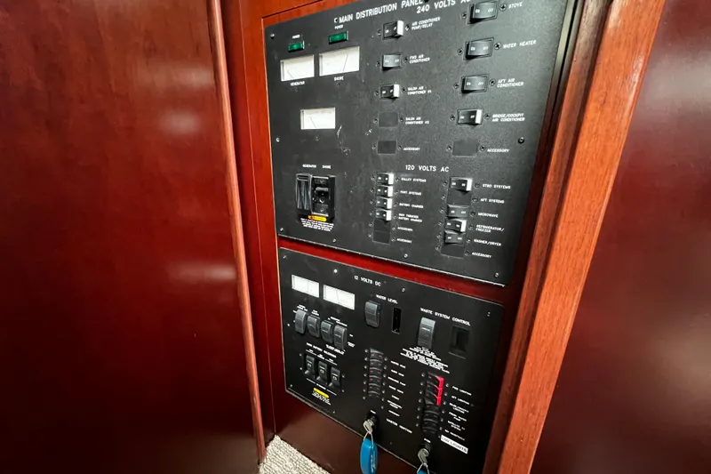 Slide: The Image of Electrical control panel on a 2006 Sea Ray 40 Motor Yacht, featuring switches and indicators. - 48