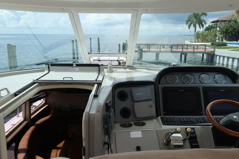 Slide: The Image of 2006 Sea Ray 40 Motor Yacht helm with ocean view and modern controls. - 27