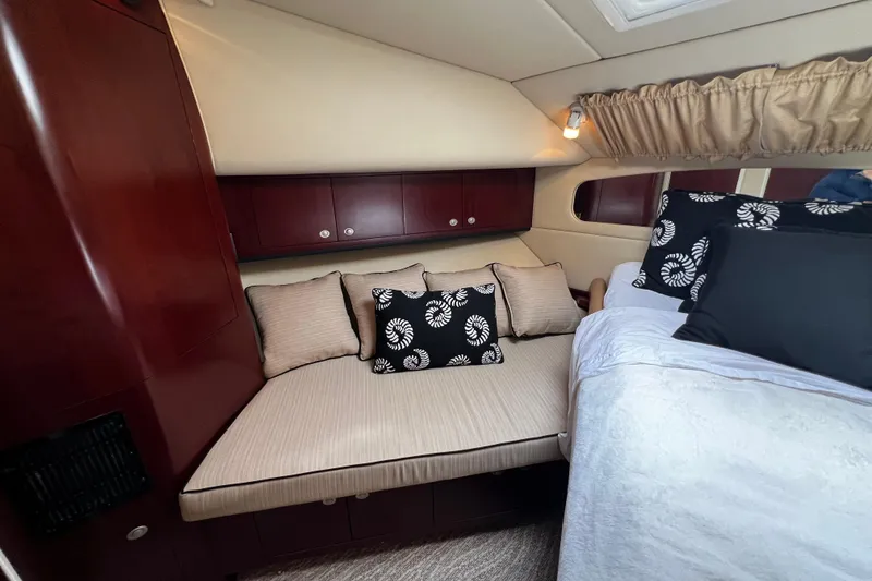 Slide: The Image of Luxurious 2006 Sea Ray 40 Motor Yacht cabin with elegant bedding and wood cabinetry. - 40