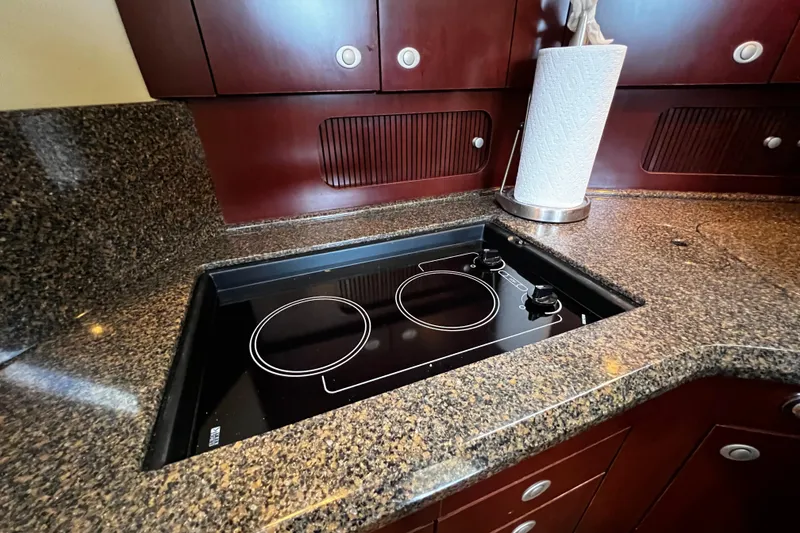 Slide: The Image of Luxury yacht kitchen with granite countertops and electric stovetop, Sea Ray 40 Motor Yacht 2006. - 35