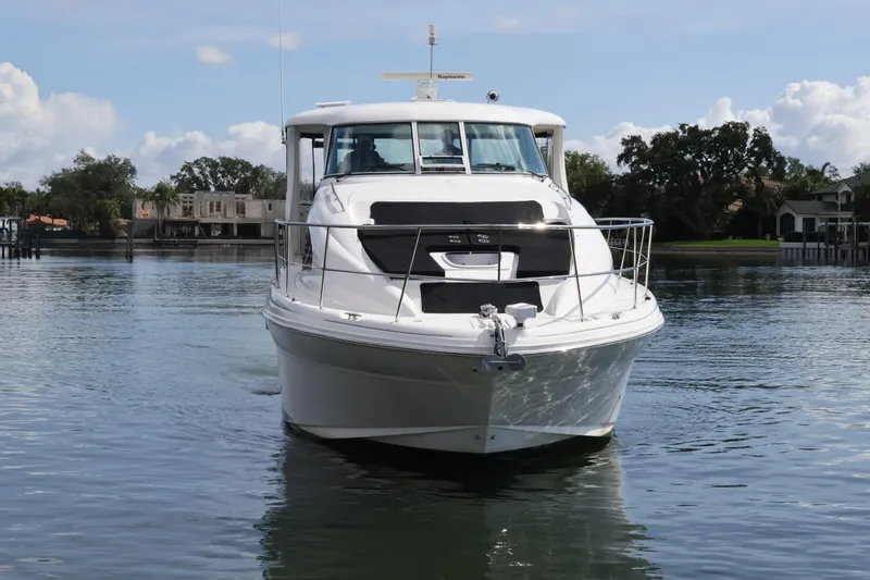 Slide: The Image of 2006 Sea Ray 40 Motor Yacht cruising on calm waters under a clear sky. - 6