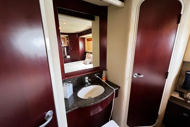 Slide: The Image of Luxurious bathroom interior of 2006 Sea Ray 40 Motor Yacht with elegant wood finish. - 44
