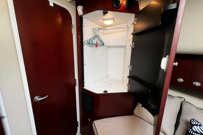 Slide: The Image of Interior of 2006 Sea Ray 40 Motor Yacht showing open closet with hangers. - 39