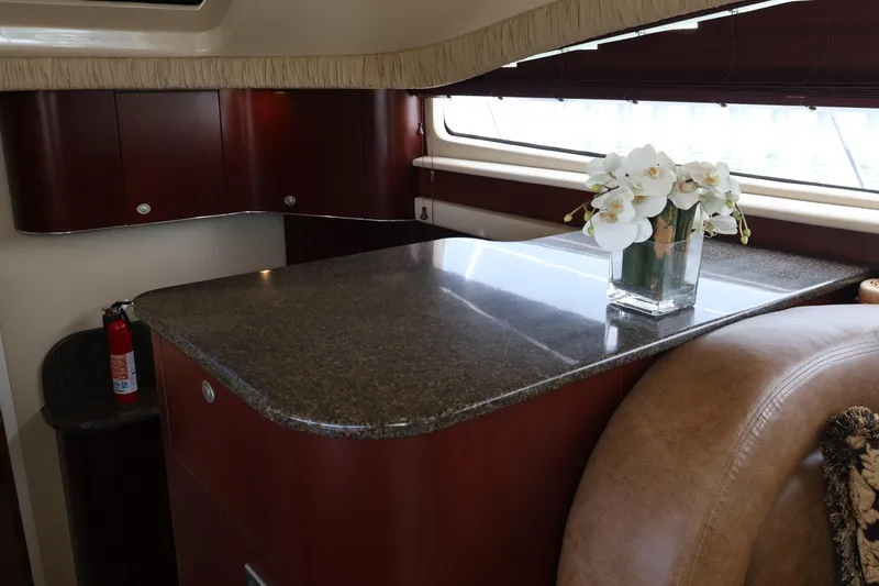 Slide: The Image of Luxurious 2006 Sea Ray 40 Motor Yacht interior with elegant countertop and floral arrangement. - 32