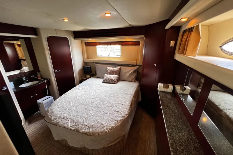 Slide: The Image of Luxurious bedroom interior of 2006 Sea Ray 40 Motor Yacht with elegant furnishings. - 43