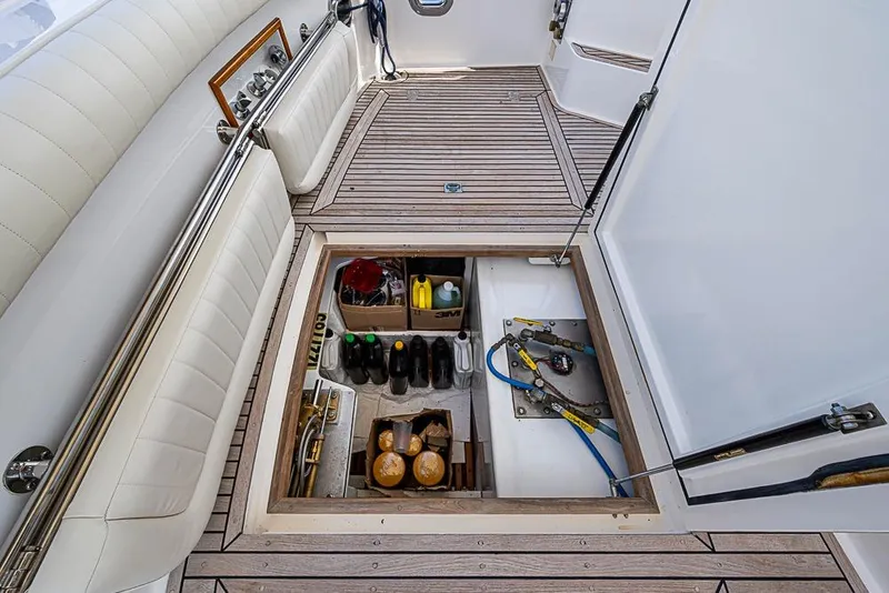 Slide: The Image of 2001 Grand Banks 49 Eastbay HX yacht storage compartment with supplies and equipment. - 16