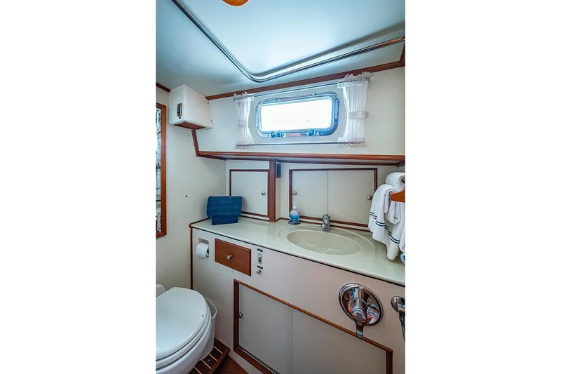 Slide: The Image of Luxurious bathroom interior of 2001 Grand Banks 49 Eastbay HX yacht, featuring elegant fixtures. - 45