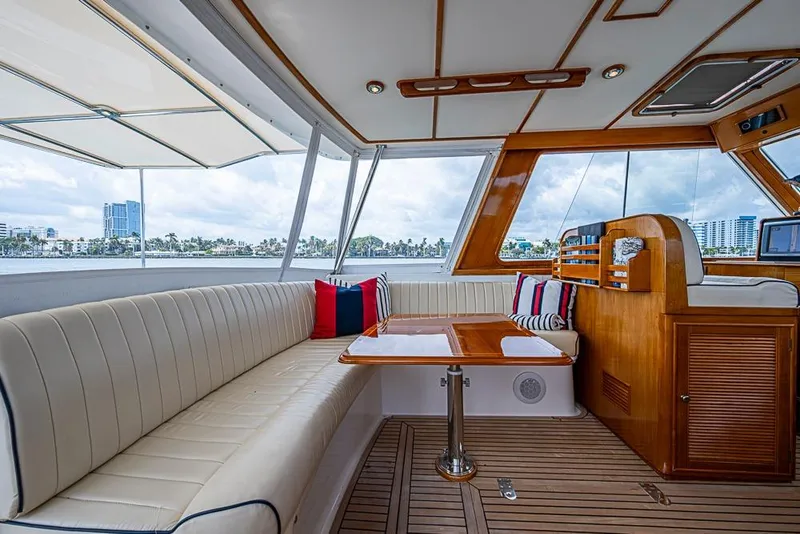 Slide: The Image of Luxurious 2001 Grand Banks 49 Eastbay HX yacht interior with elegant seating and wooden accents. - 25