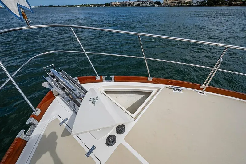 Slide: The Image of Bow of 2001 Grand Banks 49 Eastbay HX yacht with anchor and railing. - 20