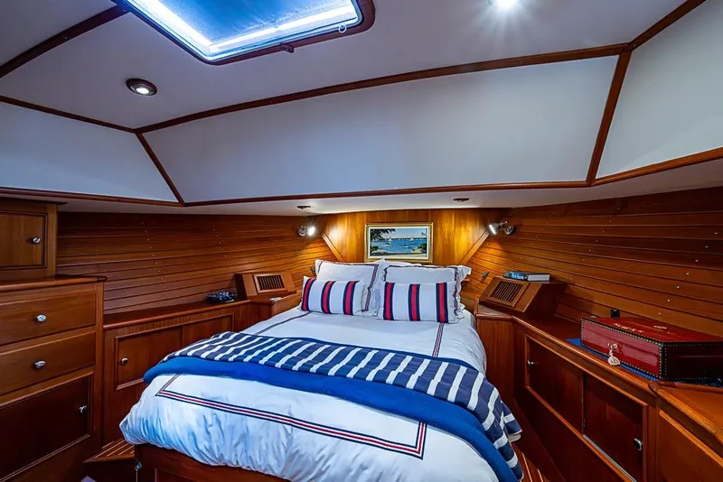 Slide: The Image of Luxurious cabin interior of 2001 Grand Banks 49 Eastbay HX yacht with wood paneling. - 41