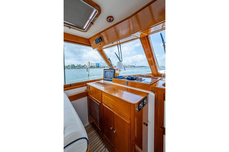 Slide: The Image of Interior of 2001 Grand Banks 49 Eastbay HX yacht with wooden cabinetry and ocean view. - 29