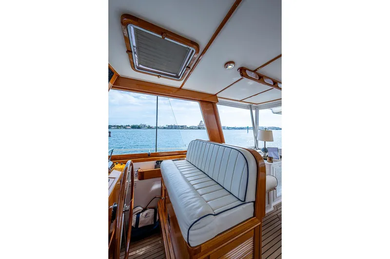 Slide: The Image of Interior of 2001 Grand Banks 49 Eastbay HX yacht with elegant seating and ocean view. - 32