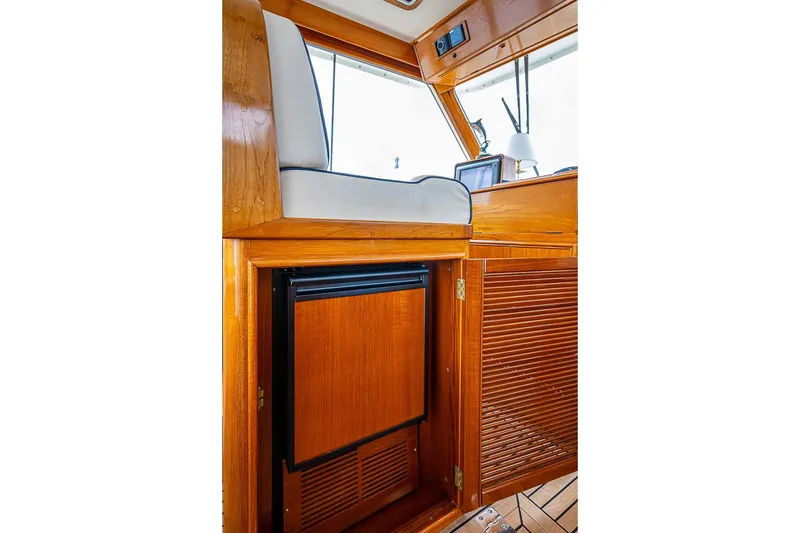 Slide: The Image of Interior of 2001 Grand Banks 49 Eastbay HX with wooden cabinetry and seating. - 31