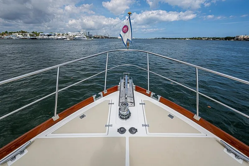 Slide: The Image of Bow view of 2001 Grand Banks 49 Eastbay HX yacht on open water. - 19