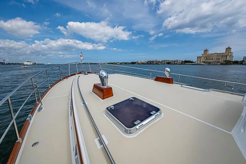 Slide: The Image of 2001 Grand Banks 49 Eastbay HX yacht deck with scenic waterfront view. - 17