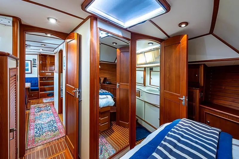 Slide: The Image of Luxurious interior of 2001 Grand Banks 49 Eastbay HX yacht with wood finish and cozy cabins. - 43