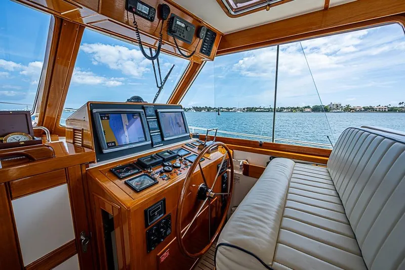 Slide: The Image of 2001 Grand Banks 49 Eastbay HX helm with navigation screens and ocean view. - 35