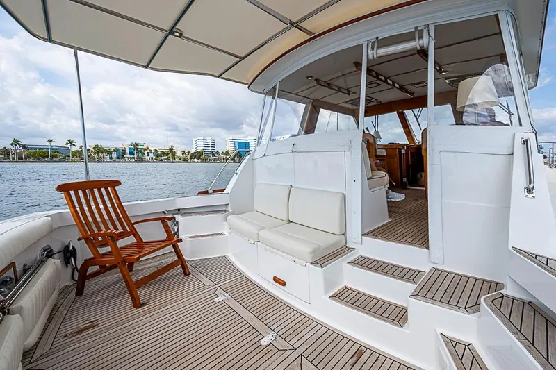 Slide: The Image of 2001 Grand Banks 49 Eastbay HX yacht with spacious deck and seating area. - 13