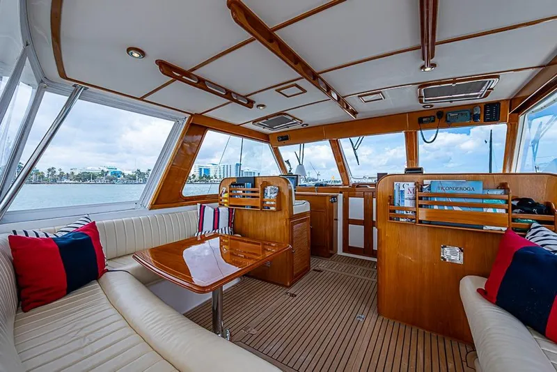 Slide: The Image of Luxurious interior of 2001 Grand Banks 49 Eastbay HX yacht with wood finish and seating. - 24