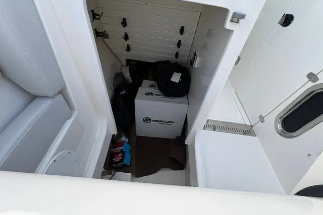 Slide: The Image of Storage compartment in a 2027 Tiara Yachts 34 LX, featuring Mercury equipment. - 32
