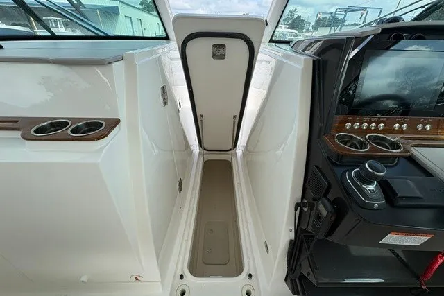 Slide: The Image of 2027 Tiara Yachts 34 LX cockpit with modern controls and sleek design. - 18