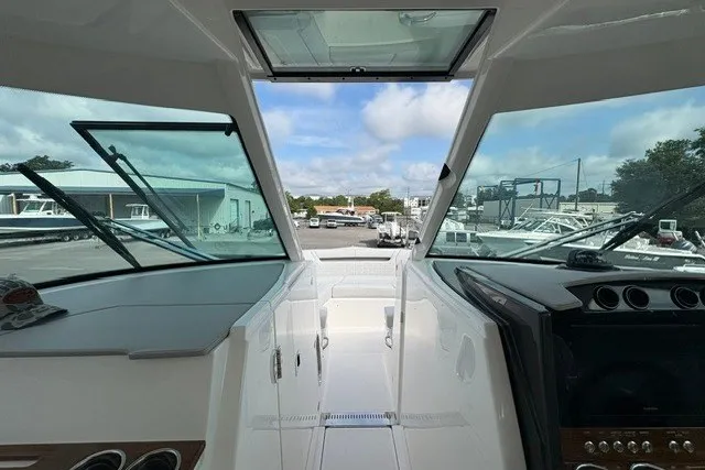 Slide: The Image of Interior view of 2027 Tiara Yachts 34 LX, showcasing sleek design and modern dashboard. - 19