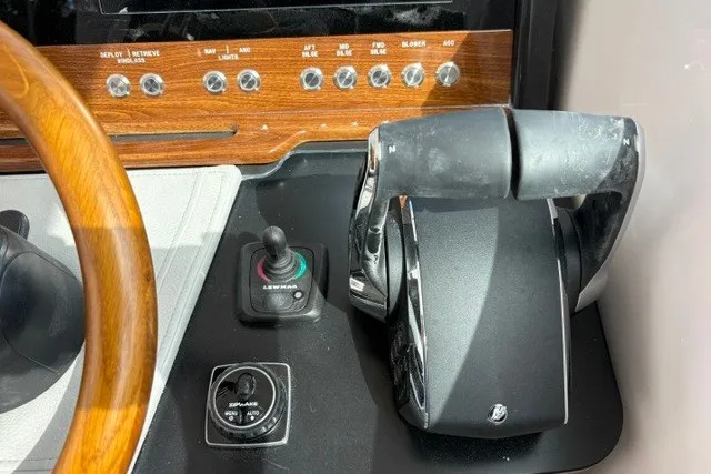 Slide: The Image of Control panel of a 2027 Tiara Yachts 34 LX, featuring throttle and joystick controls. - 25