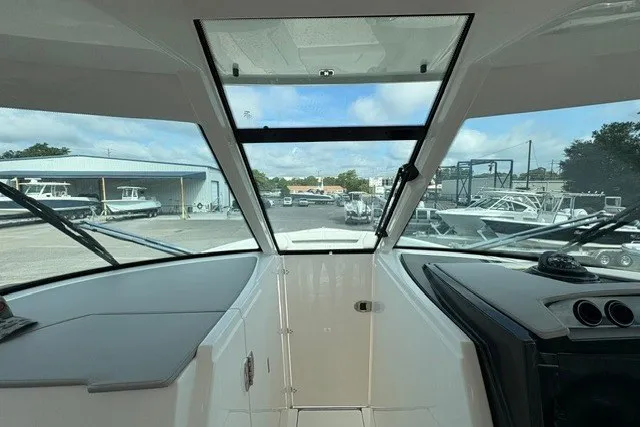 Slide: The Image of Interior view of 2027 Tiara Yachts 34 LX, showcasing sleek design and panoramic windows. - 20