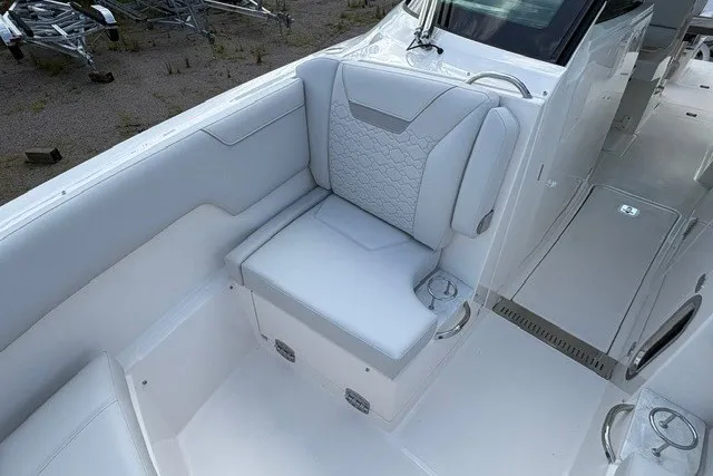 Slide: The Image of Luxurious seating on 2027 Tiara Yachts 34 LX, featuring elegant white upholstery and modern design. - 30